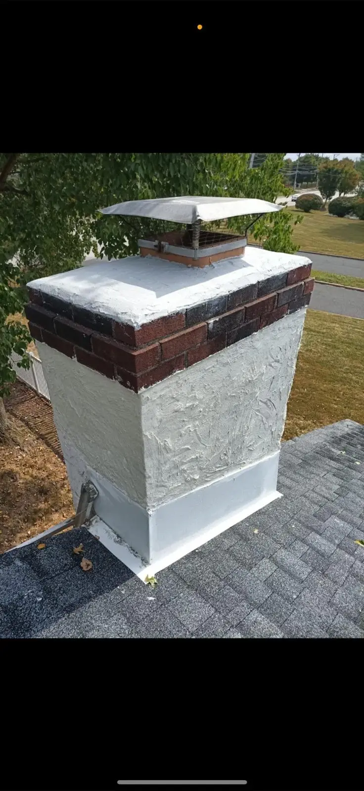 Sealed and waterproofed chimney with a new crown on a Dallas home