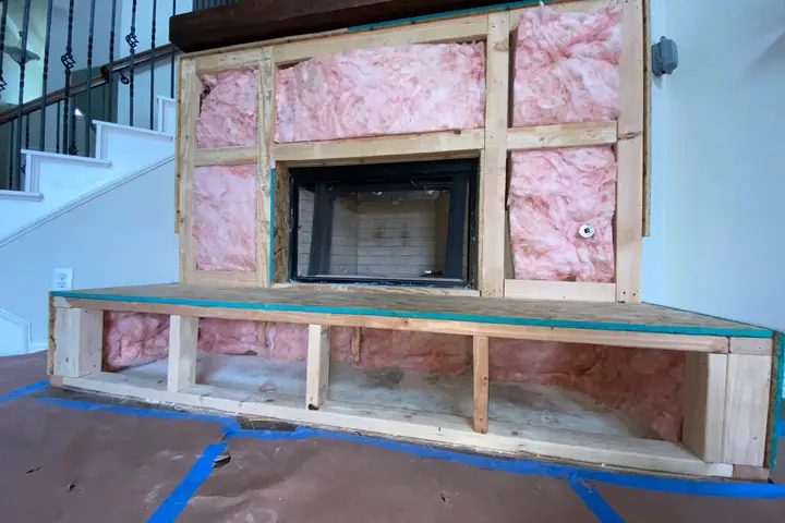 New fireplace insert framed in during an installation in a Dallas home